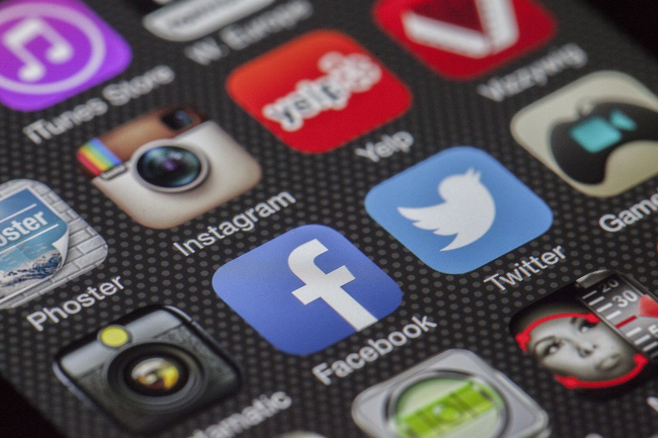 services-hero Close-up image of various social media app icons on a smartphone screen.